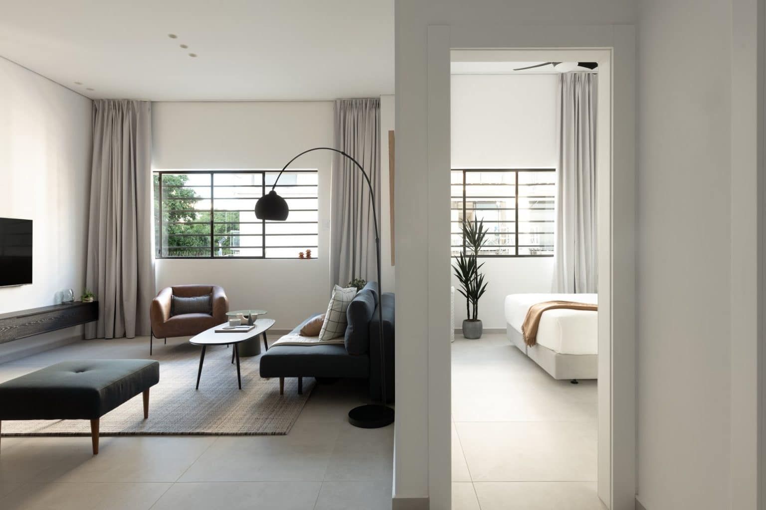 Furnished living room and bedroom in a TLV2GO relocation apartment at Mr. Rothschild, Tel Aviv